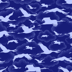 Naklejka premium white silhouettes of cranes on the background of unusual clouds drawing in the dot technique. Seamless pattern, repeating background in two colors - blue and white