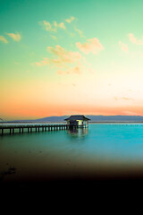 Kwan Phayao Lake with the silhouette of the mountain range at sunset in Phayao Province