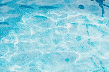 Blue water texture. Blurred background with blue water in the pool