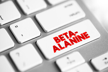 Beta-alanine is the building block of carnosine, a molecule that helps buffer acid in muscles, text concept button on keyboard - 797583911