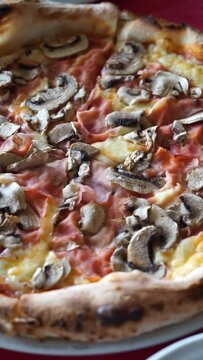 pizza with mushrooms and shredded vertical video