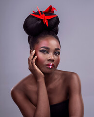 Black woman, studio and portrait with origami for beauty, traditional or creative with cosmetics....