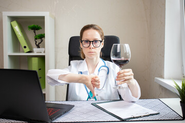 doctor refuses alcohol, shows thumbs down to glass of wine, harm to health, reject liquor