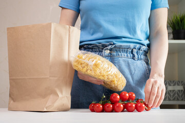 Woman takes groceries out of bag, fresh produce, healthy eating, market visit