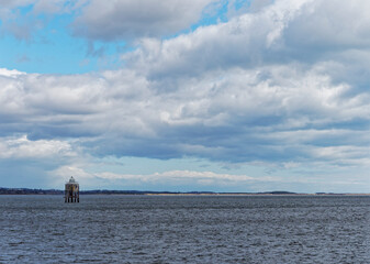 The Larrick Beacon in the middle of the Tay Estuary, seen from Tayport, with the beaches of...