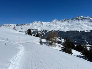 Amazing sport-recreational snowy winter tracks for skiing and snowboarding in the area of the tourist resorts of Valbella and Lenzerheide in the Swiss Alps - Canton of Grisons, Switzerland (Schweiz)