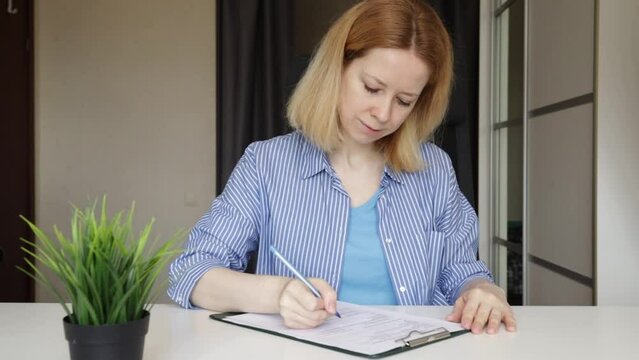 fill out documents, a woman writes on forms, financial management, budget planning