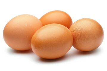 A cluster of fresh brown chicken eggs with a natural speckled pattern isolated on a white background.