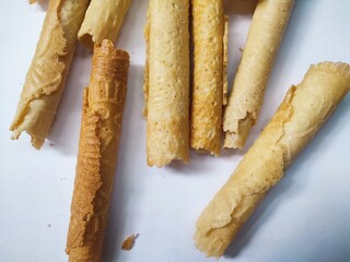 Kue semprong or Asian egg roll. This is a traditional Indonesian wafer or kuih snack isolated on a white background