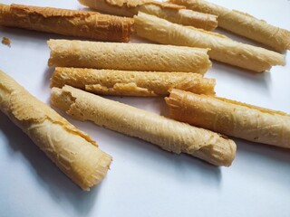 Kue semprong or Asian egg roll. This is a traditional Indonesian wafer or kuih snack isolated on a white background