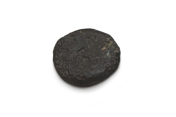 The shape is round, flat and thick of tektite natural stone meteorite isolated on white background.