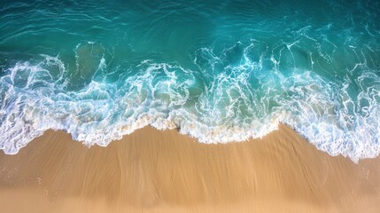 A sandy beach with gentle waves rolling onto the shore, under a clear sky showing the vast ocean