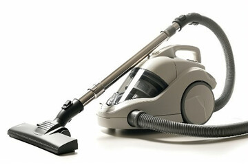 A compact canister vacuum cleaner with a HEPA filter and telescopic wand for above-floor cleaning isolated on a solid white background. - obrazy, fototapety, plakaty