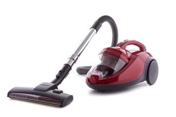 A compact canister vacuum cleaner with a retractable cord and onboard accessory storage isolated on a solid white background.