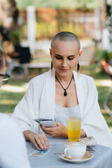 A bald woman tarot reader has a session with a client