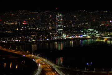 Fototapeta na wymiar Cityscape of Vienna with Millennium Tower near the New Danube River. View from the observation deck of the Danube Tower at night, Austria