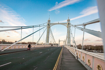 Albert Bridge is a road bridge over the River Thames connecting Chelsea in Central London on the north bank to Battersea on the south. - obrazy, fototapety, plakaty