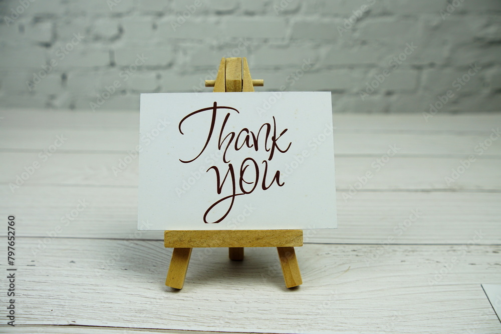 Wall mural thank you text on paper card with wooden easel stand - Wall murals
