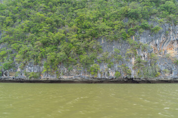 Obraz premium Clear blue turquoise seawater, Andaman sea in Phuket island in summer season, Thailand. Water in ocean pattern wallpaper background.