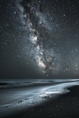 The beach at night with the night sky and stars and the Milky Way.