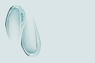 composition of smears of cosmetic blue gel on a blue background