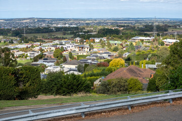 Elevated view of Geelong’s suburban neighbourhood with many Australian homes and houses. Concept of real estate housing market in regional Australia, skyline of suburbs. Wandana Heights lookout.
