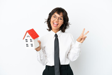 Real estate mixed race agent isolated on white background smiling and showing victory sign
