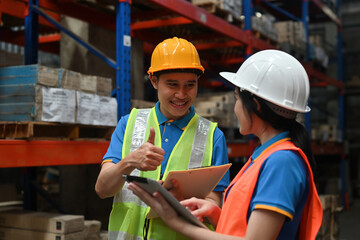 Warehouse worker giving a thumbs up to co-workers, Praise, and encouragement for coworkers