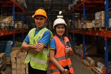 Portrait of Confident male and female warehouse employees