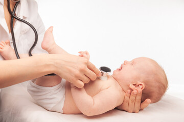Pediatric Check-up Doctor Examining a Crying Baby with Stethoscope