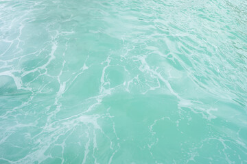 Clear blue turquoise seawater, Andaman sea in Phuket island in summer season, Thailand. Water in ocean pattern wallpaper background.