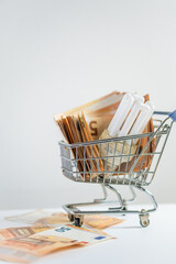 shopping cart with light bulb and 50 euro note bills concept of utility increasing inflation price 