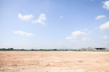 Obraz premium Land, blue sky and clouds. Include landscape, empty or vacant area at outdoor. Real estate or property for sale, rent, but, development, housing subdivision and construction in Chiang Mai of Thailand.