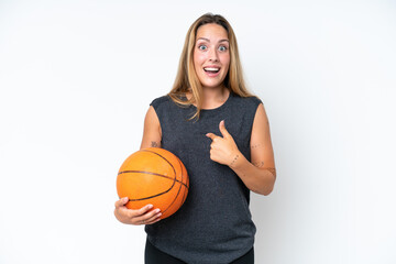 Young basketball caucasian player woman isolated on white background with surprise facial expression