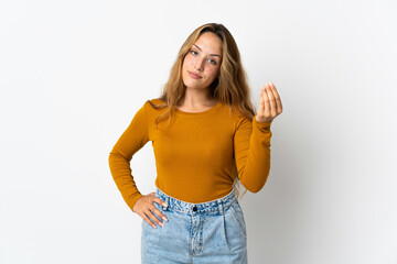 Young blonde woman isolated on blue background making Italian gesture
