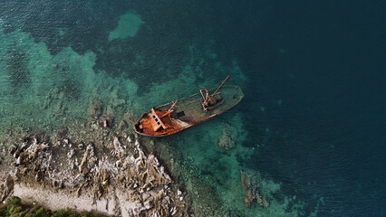 A sunken ship off the coast of the Lustica peninsula in the Bay of Kotor in the Adriatic Sea, Montenegro. View from above. Drone photo. 