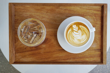Iced coffee and Latte coffee on wooden tray with High angle view