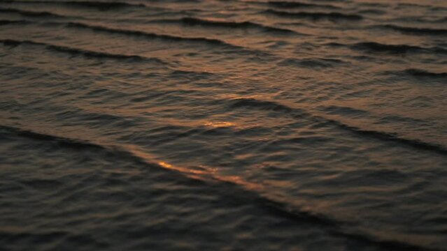 Tiny wavelets reflecting the sunset light