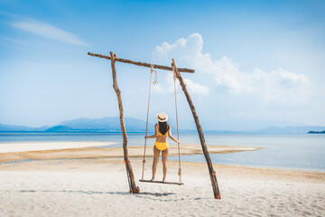 Traveler asian woman relax and travel in swing on summer beach at Koh Rap Samui in Surat Thani Thailand - 797713755