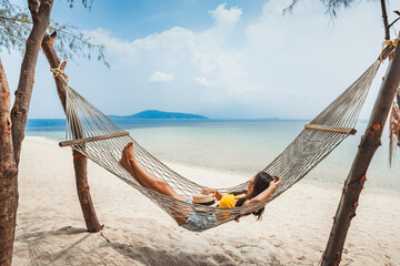 Traveler asian woman relax and travel in hammock on summer beach at Koh Rap Samui in Surat Thani Thailand - 797713779