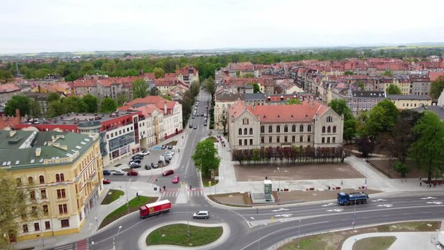Aerial View Of Cars Driving In The Street In Front Of Economic School Complex In Legnica, Poland.