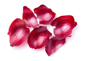 Bright red onion skins, rich in texture and color, captured in high detail against a white...
