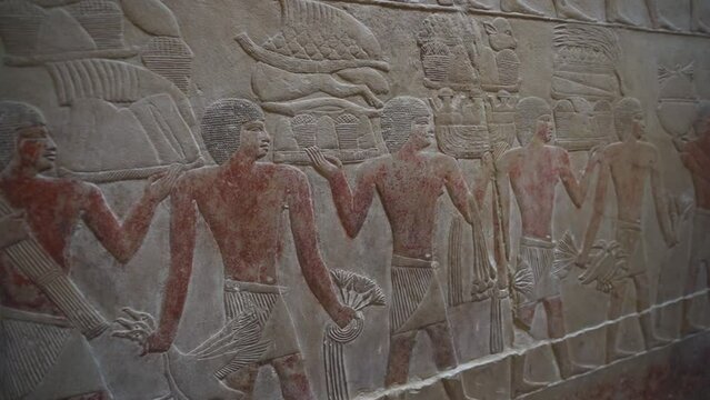 Ancient hieroglyphics on the walls of Egyptian pyramids: intricate symbols revealing stories of a rich civilization and historical wonders.