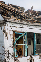 An old destroyed house in Ukraine, ruins after artillery shelling, bombing. War, Russian...