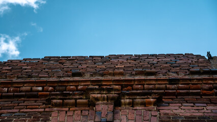 Fototapeta premium ruins of an old brick building overlooking the sky