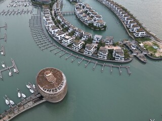 Aerial and topdown view of the port in the city of Xiamen, China at sunset