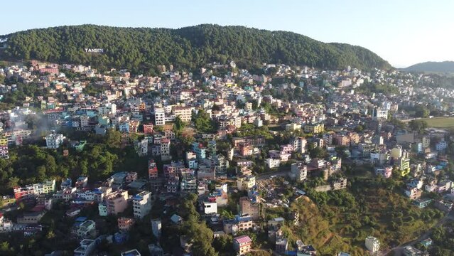Aerial footage of the cityscape of Tansen on a sunny day in Palpa city in Lumbini in central Nepal