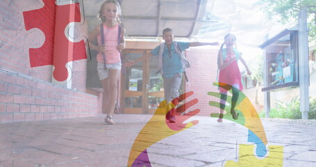 Image of puzzles falling over ribbon formed with puzzles and school children running in school