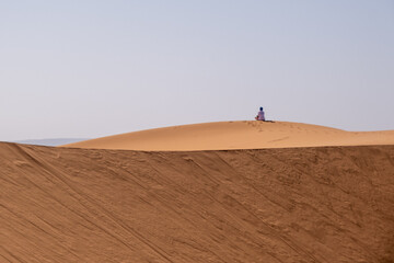 person walking in the desert The most beautiful safaris in the desert _ Moroccan desert _ camel...