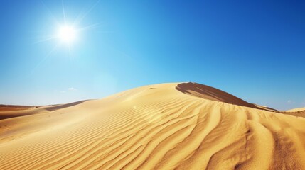 Majestic desert dunes under a clear blue sky: the beauty of arid landscapes.